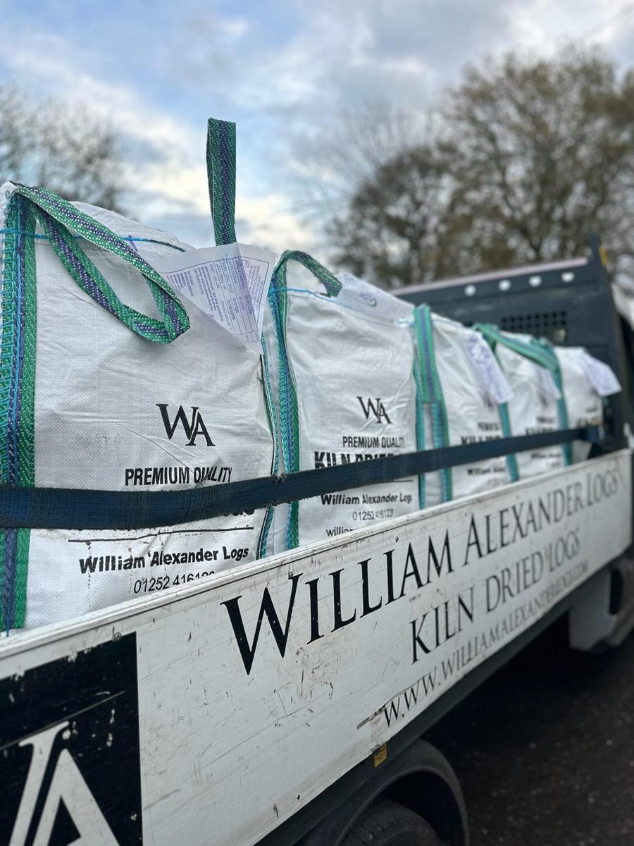 A William Alexander van loaded with barrow bags of kiln-dried logs